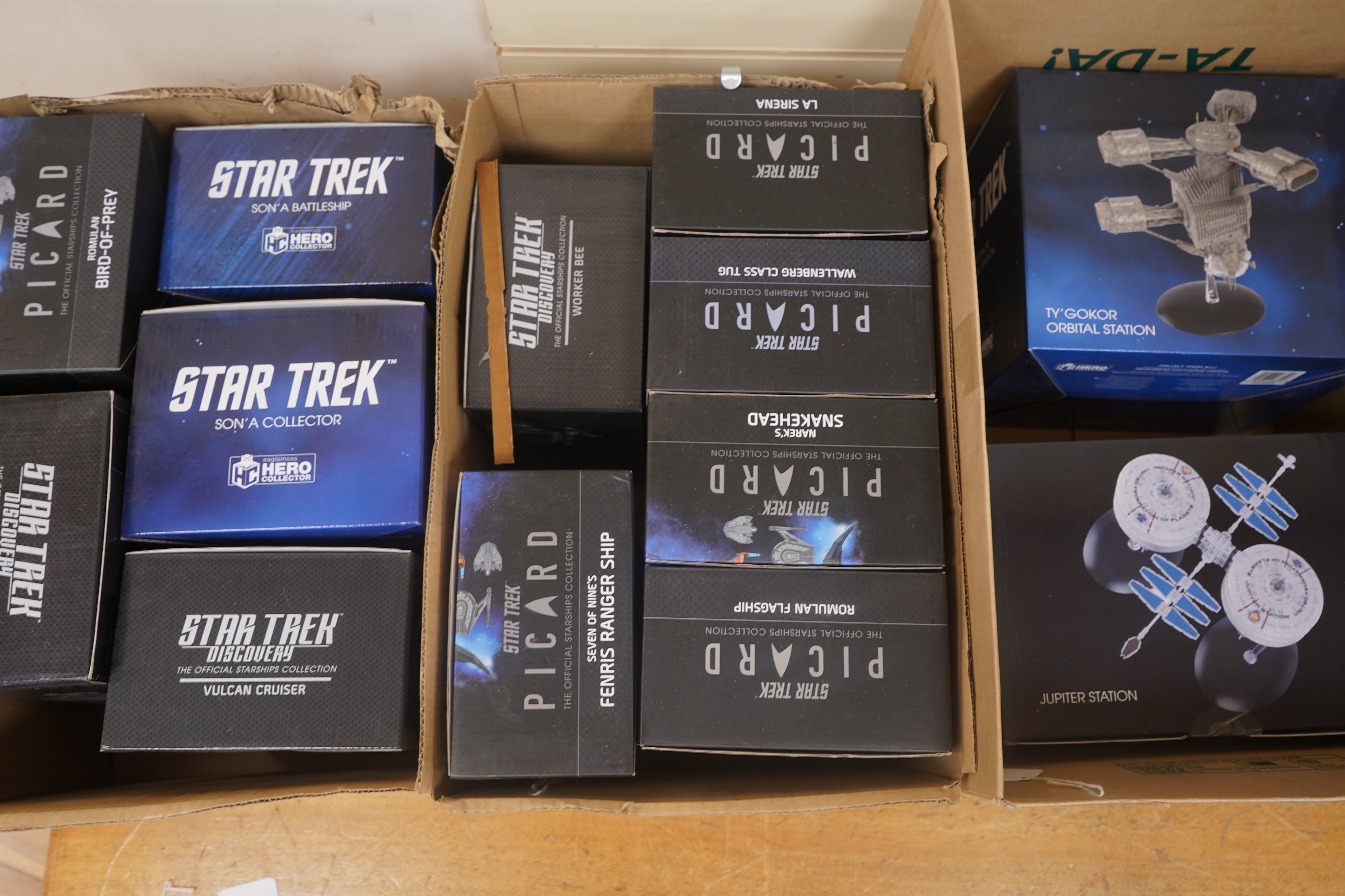Eighteen boxed Eaglemoss Star Trek magazine issue models, including; a Vulcan Cruiser, a Klingon Qugh Class vessel, a Son’a Battleship, a Romulan Flagship, Jupiter Station, Ty’Gokor Orbital Station, etc. Condition - good
